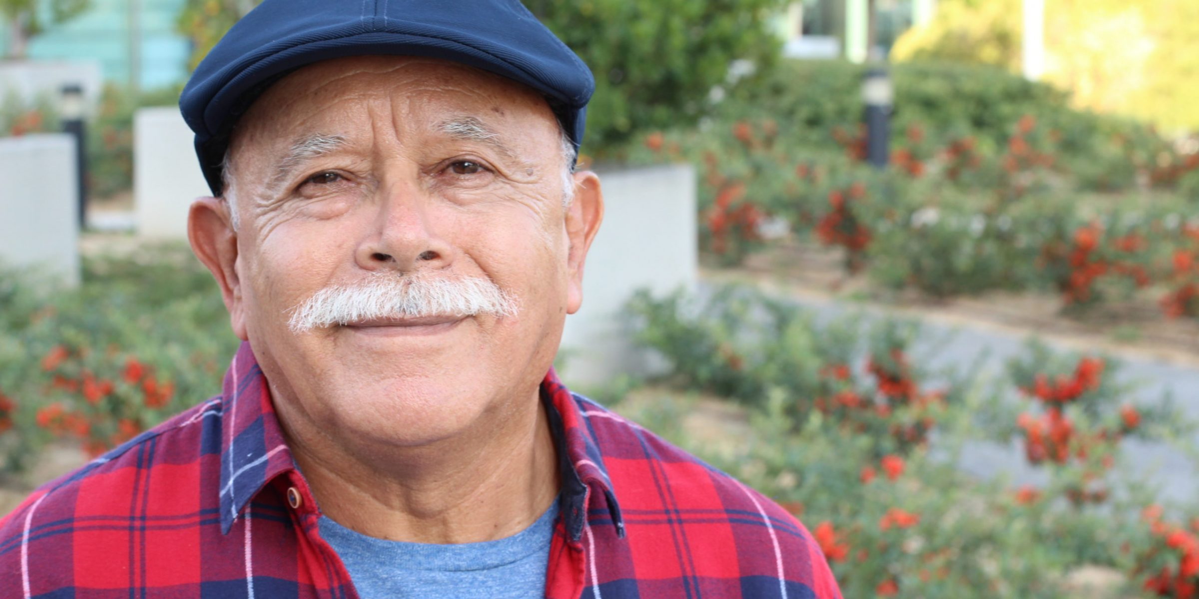 Senior Hispanic man outdoor headshot